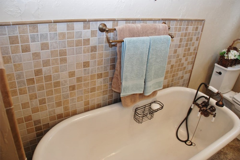 Cast Iron Bath Tub with tile backsplash